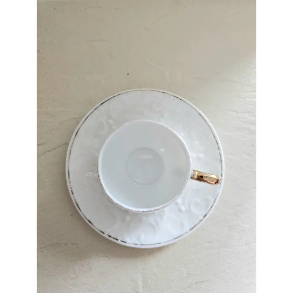 Vintage Miniature White Raised Design Cup And Saucer
